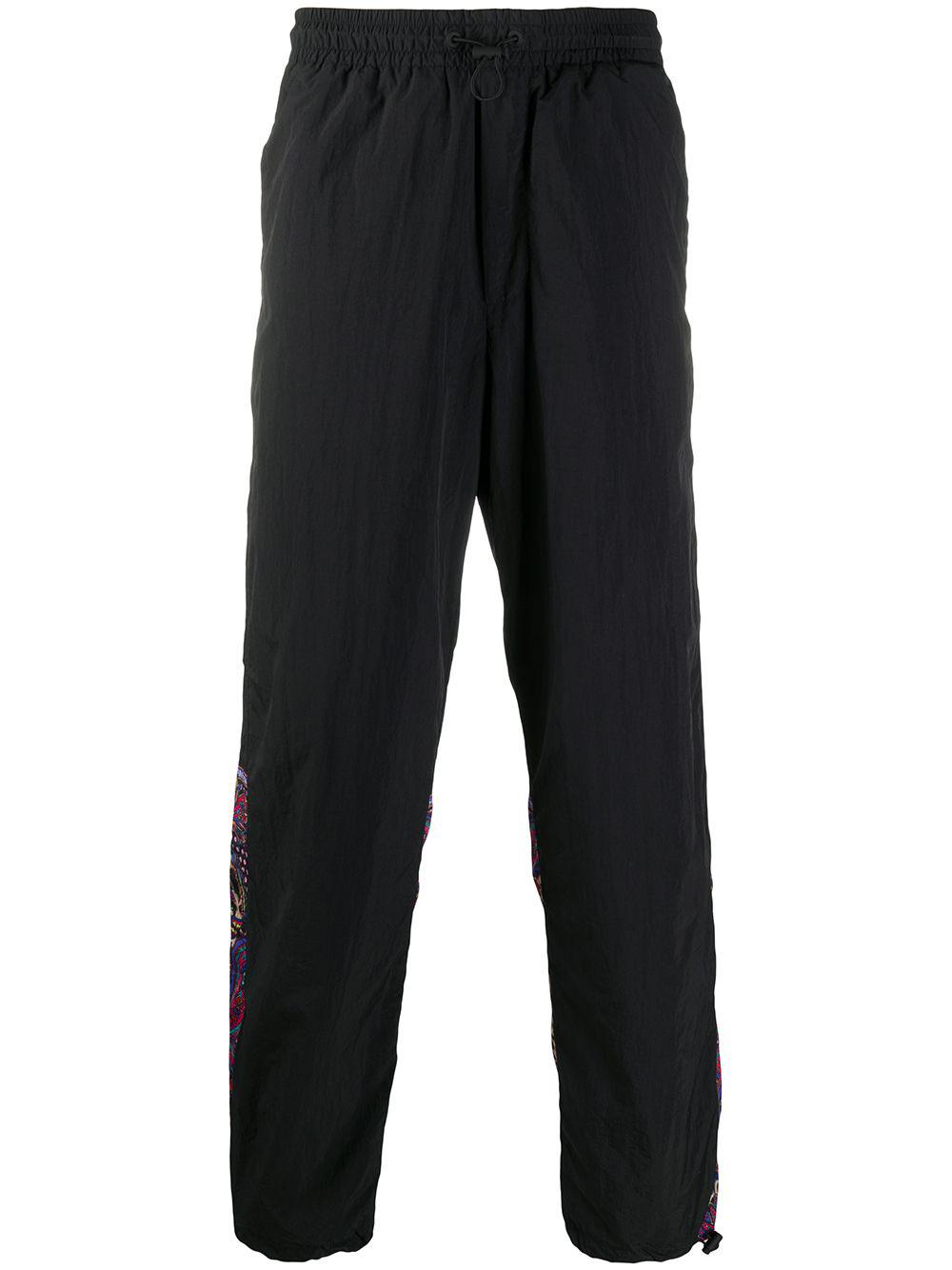 logo print track pants by VERSACE