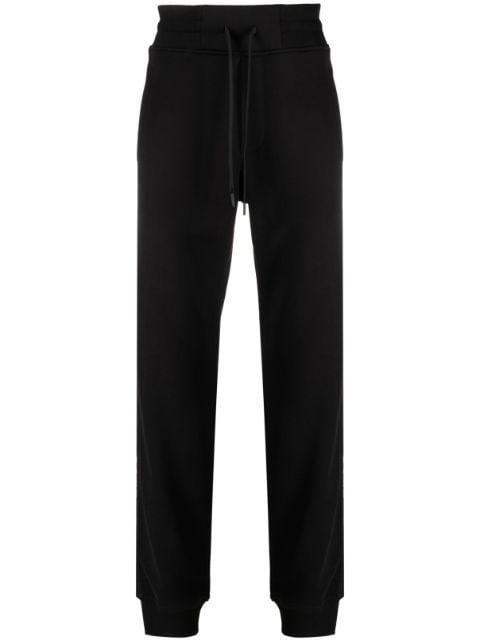 logo-tape track pants by VERSACE