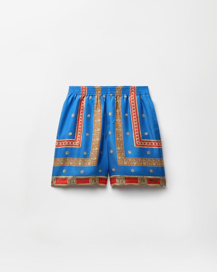 printed silk twill shorts by VERSACE