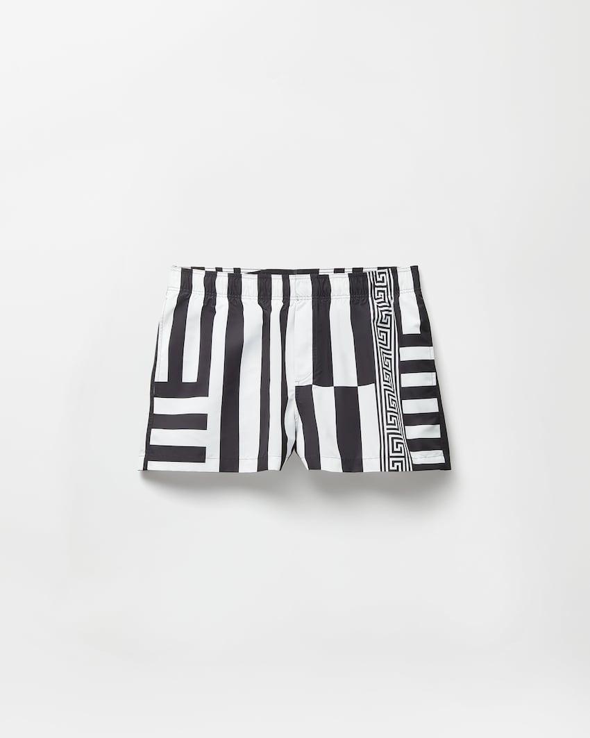printed swim shorts by VERSACE