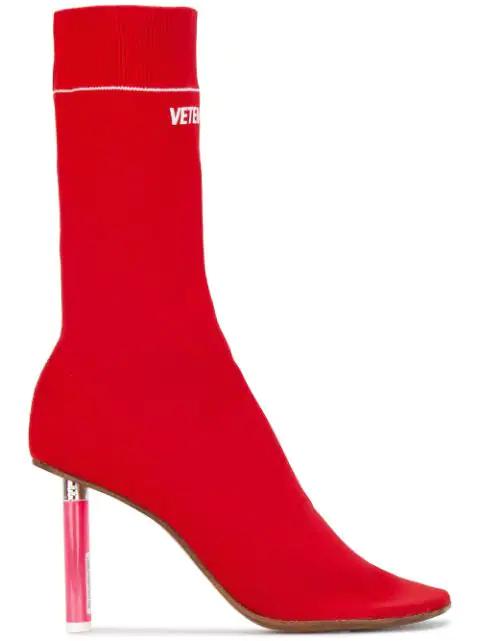 Red lighter heel sock boots by VETEMENTS