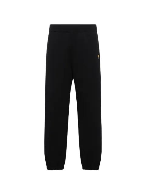 flower-embroidered track pants by VOWELS