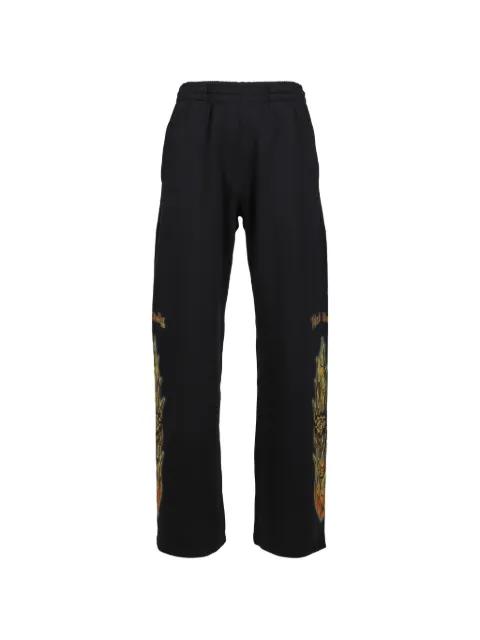 flame-graphic track pants by WE11DONE