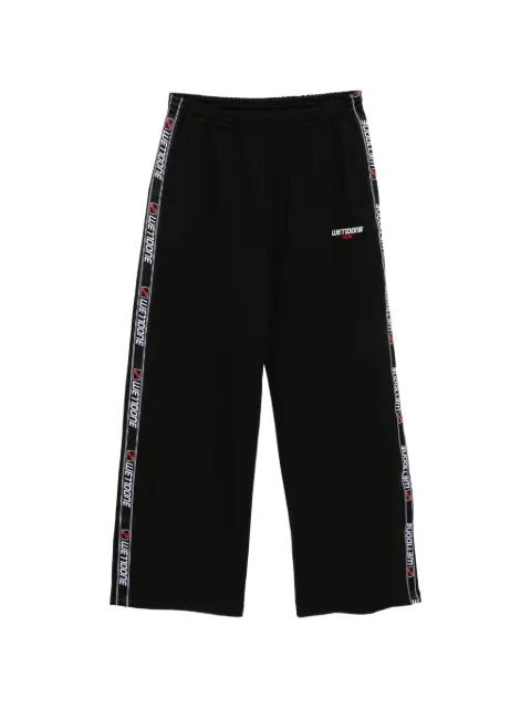 logo-tape trousers by WE11DONE