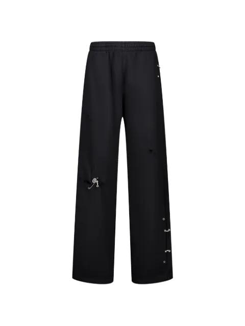 piercing-detail track pants by WE11DONE