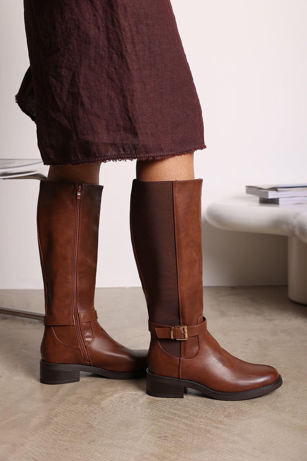 'Oriana' Faux Leather Knee High Riding Boots With Side Buckle Strap by WHERE'S THAT FROM