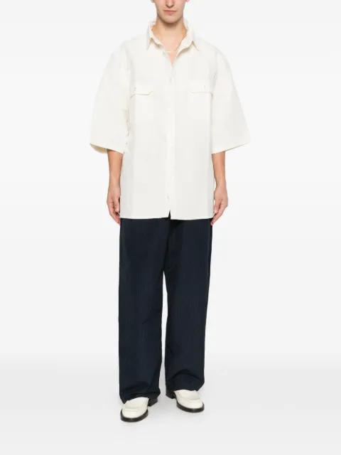 flap pockets shirt by WILLY CHAVARRIA