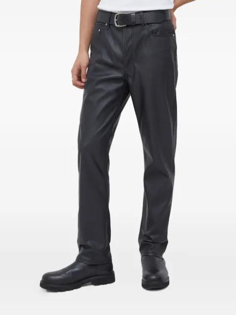 pockets logo-patch leather trousers by WON HUNDRED
