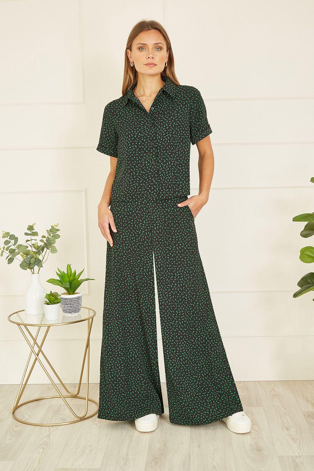 Black Ditsy Floral Print Relaxed Wide Leg Trousers by YUMI