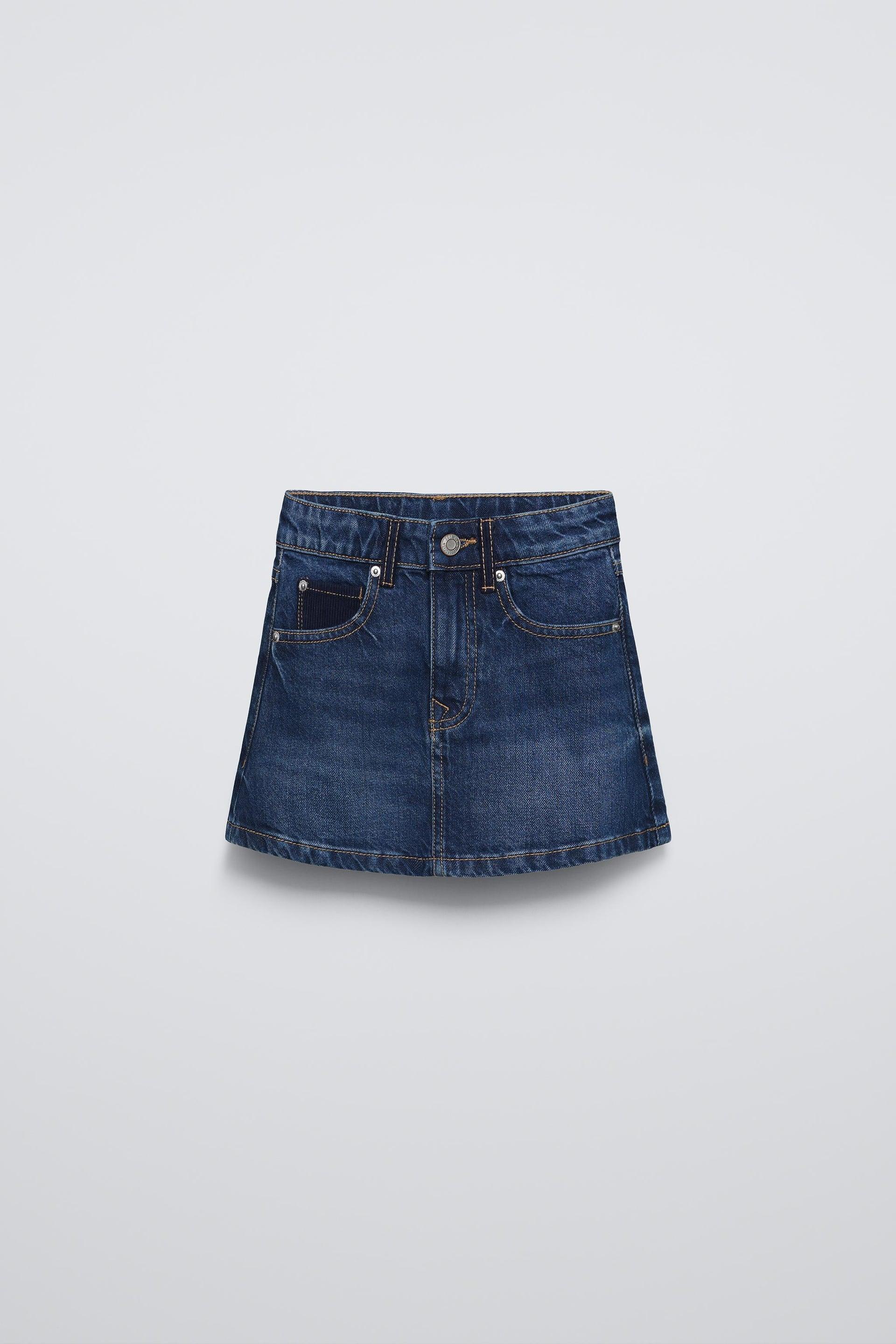 Denim skirt with adjustable interior waistband and front button closure. Front pockets and back patch pockets. by ZARA