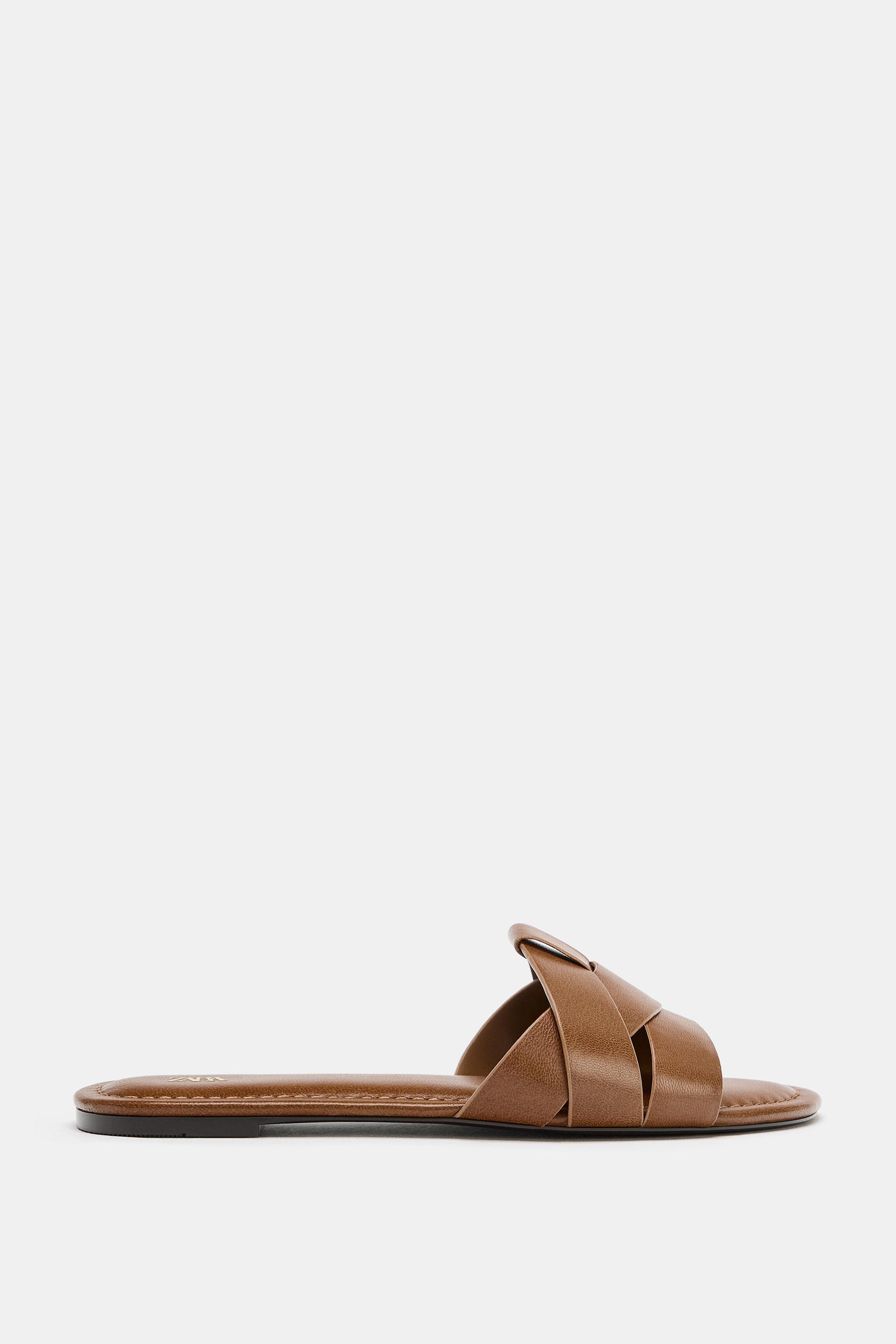 FLAT CROSSED-STRAP LEATHER SANDALS by ZARA