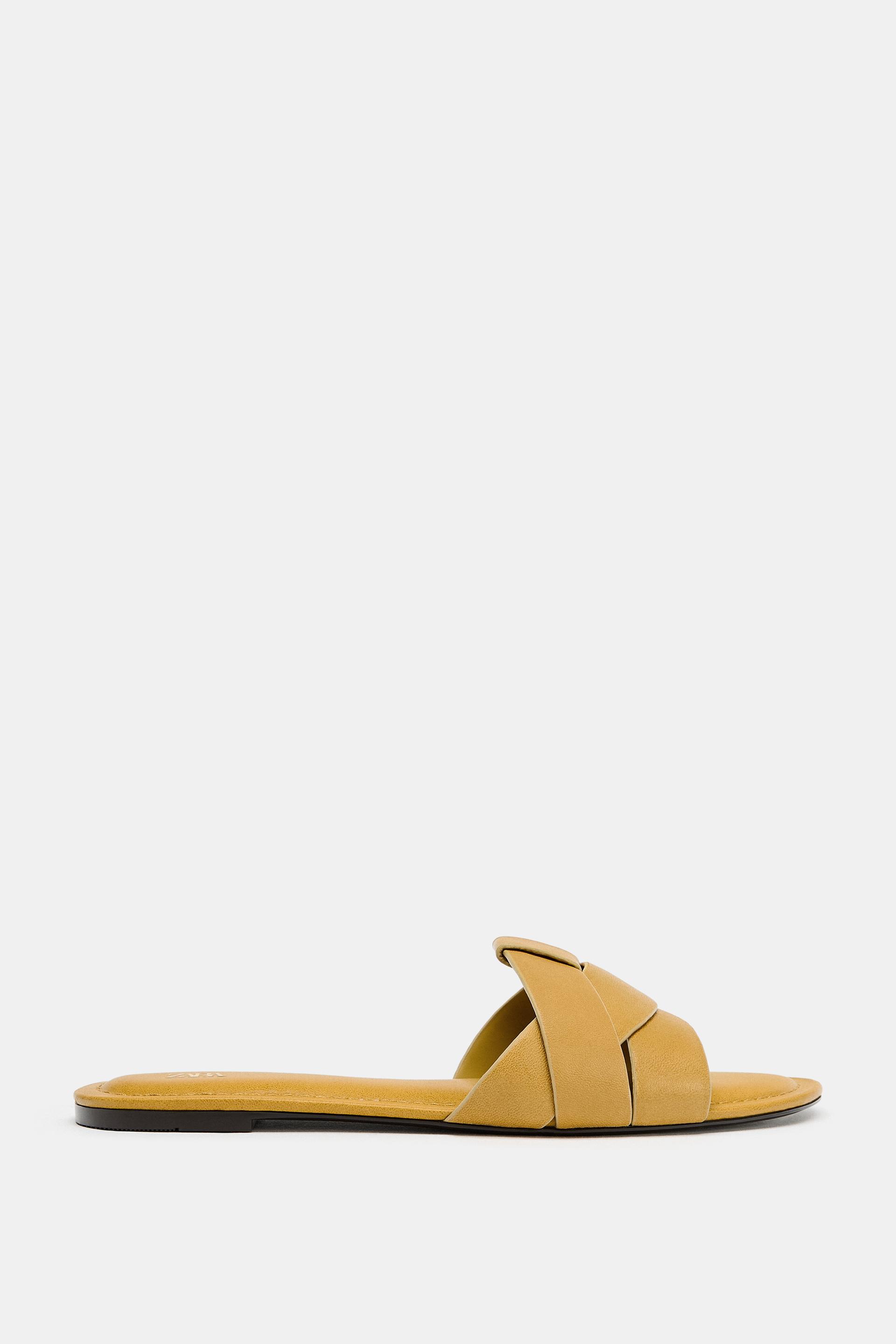 FLAT CROSSED-STRAP LEATHER SANDALS by ZARA