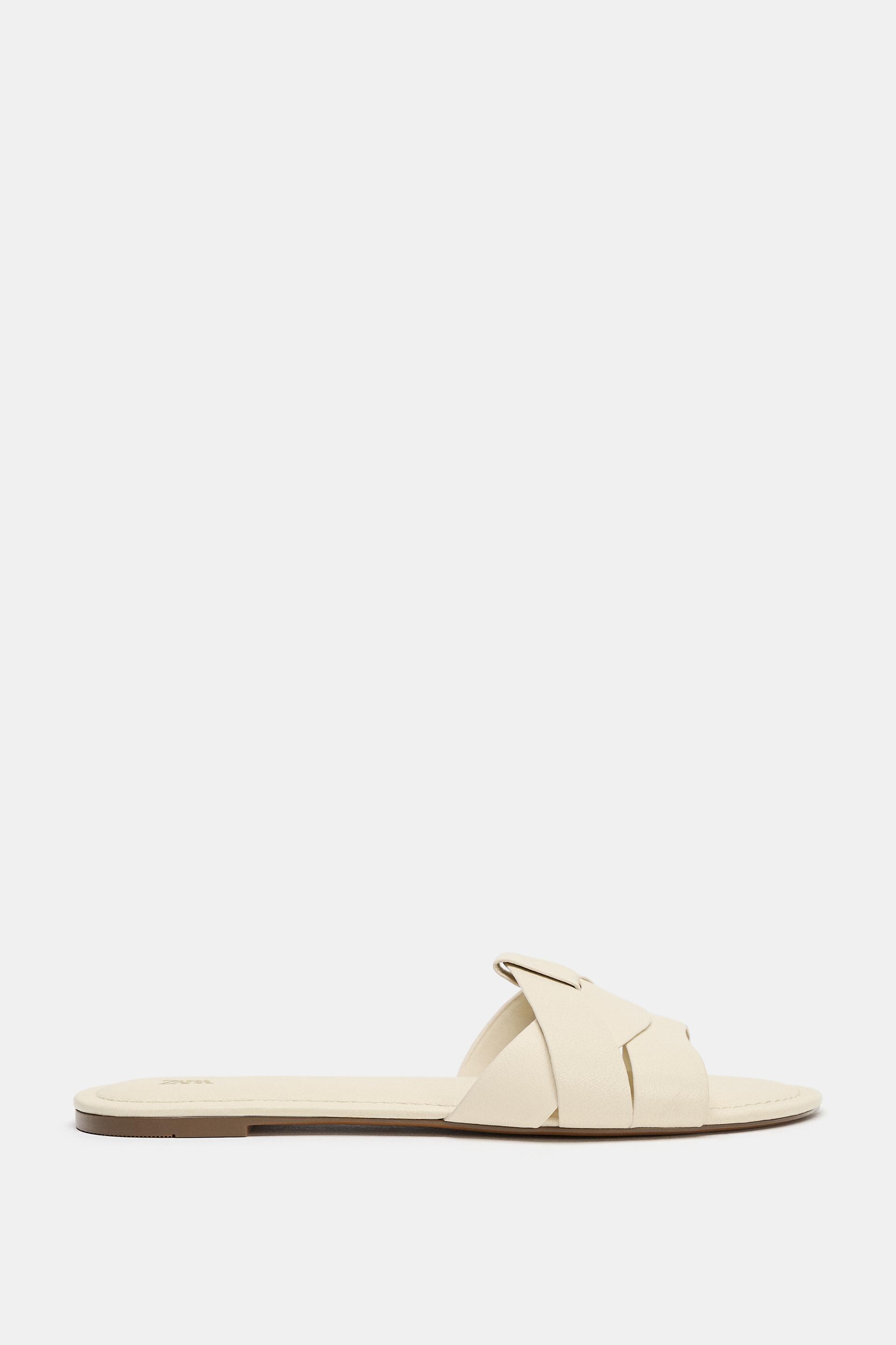 FLAT CROSSED-STRAP LEATHER SANDALS by ZARA