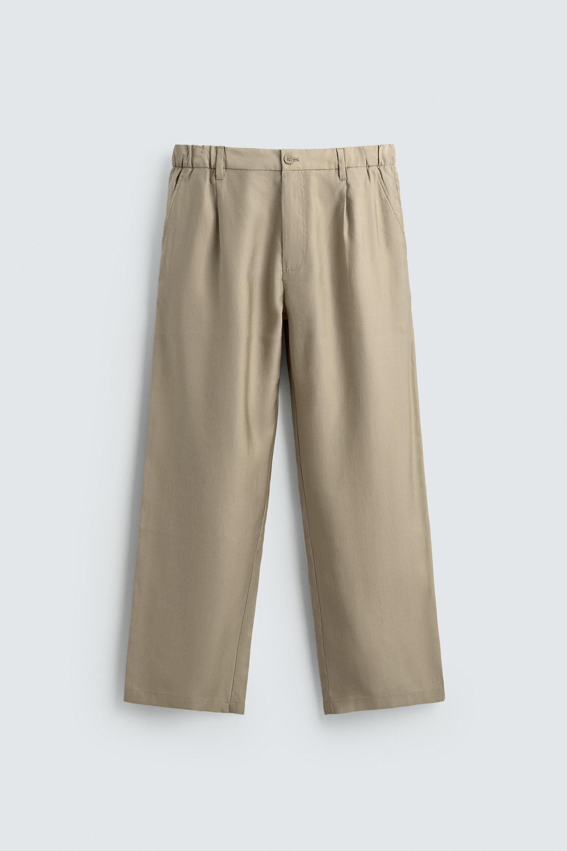 FLOWY PLEATED PANTS by ZARA