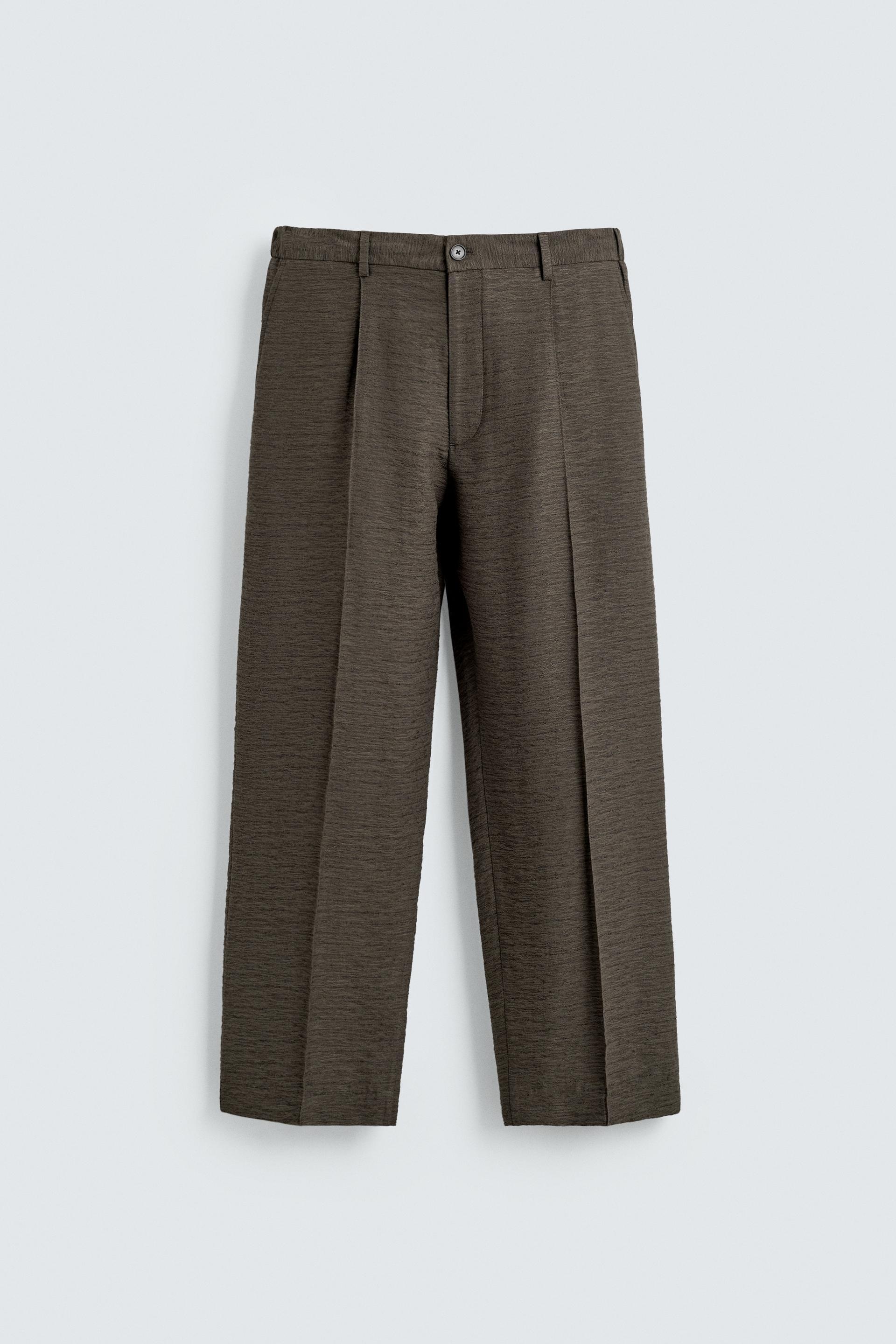 FLOWY TEXTURED PLEATED PANTS by ZARA
