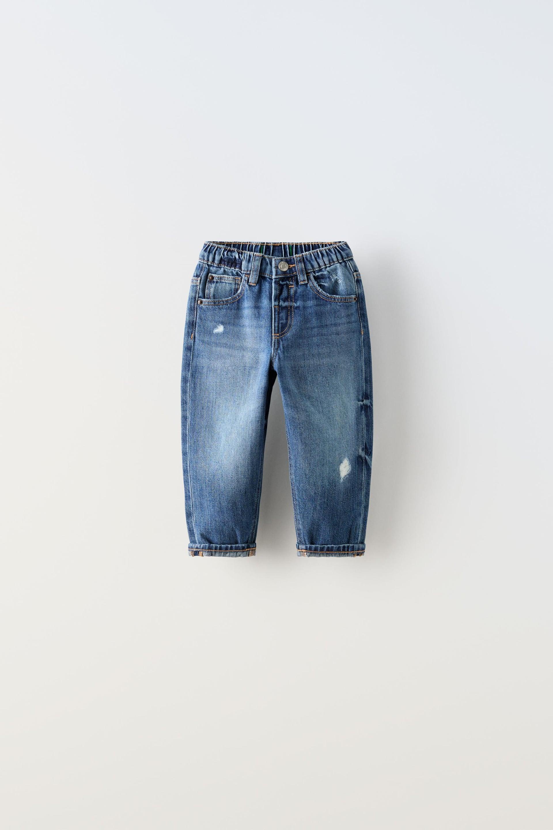 LOW-RISE RIPPED JEANS by ZARA