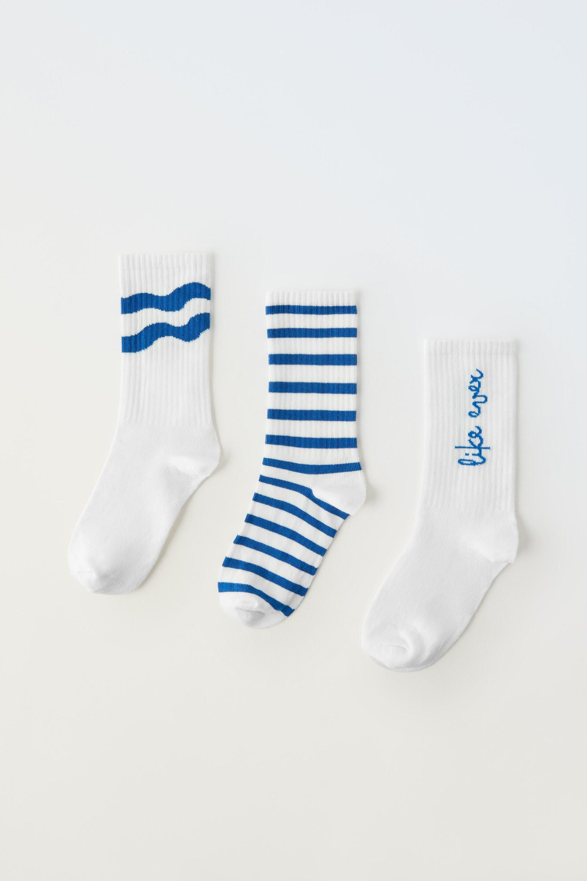 PACK OF THREE PAIRS OF LONG STRIPED AND SLOGAN SOCKS by ZARA