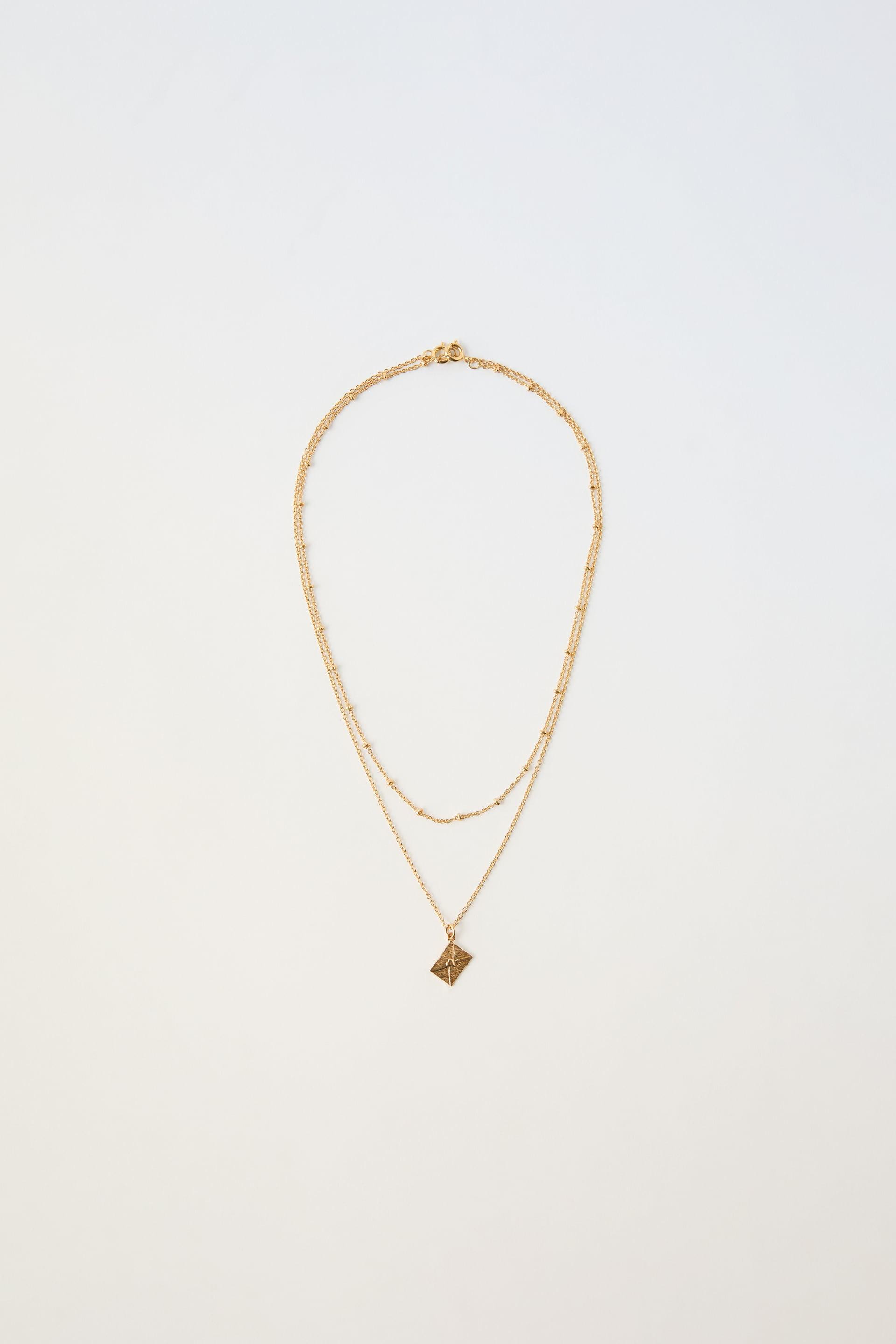 PACK OF TWO BEAD AND CHARM NECKLACES PLATED IN 24K GOLD by ZARA