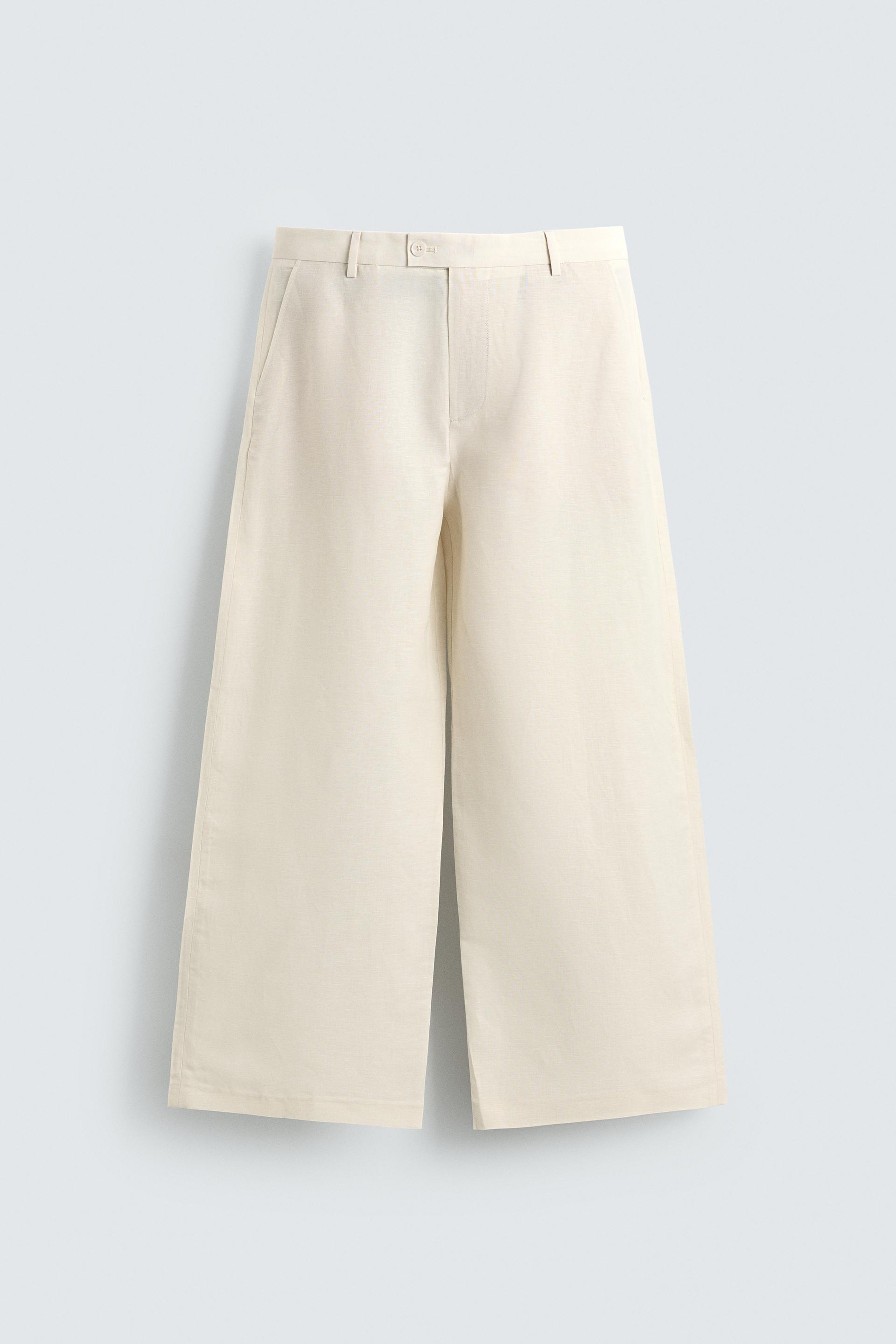 RELAXED FIT PLEATED PANTS by ZARA