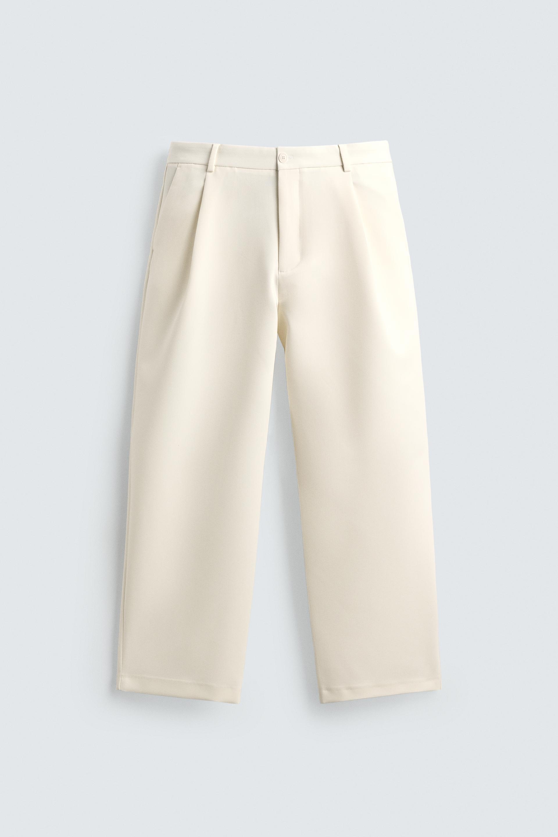 RELAXED FIT PLEATED PANTS by ZARA